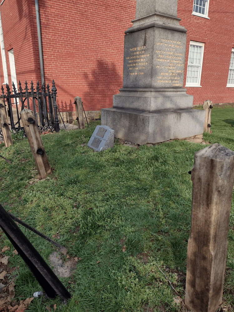 Signer John Hart’s memorial obelisk before landscaping work began.