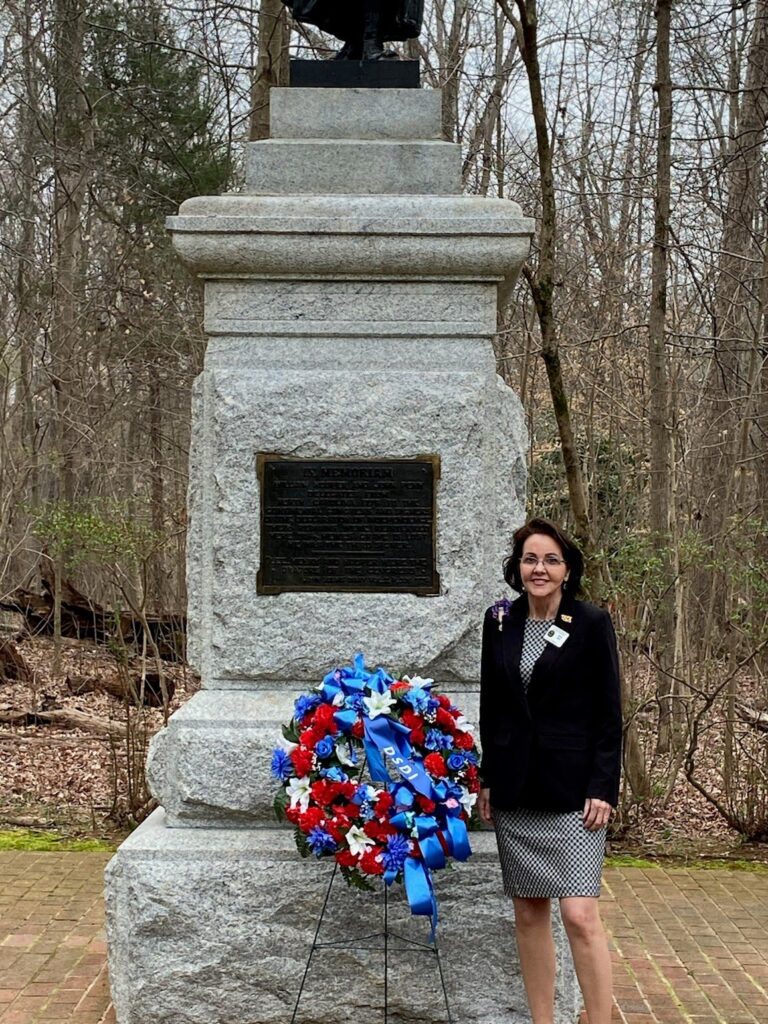 Sheryll Albert at Guilford Courthouse monument to Signers William Hooper and John Penn