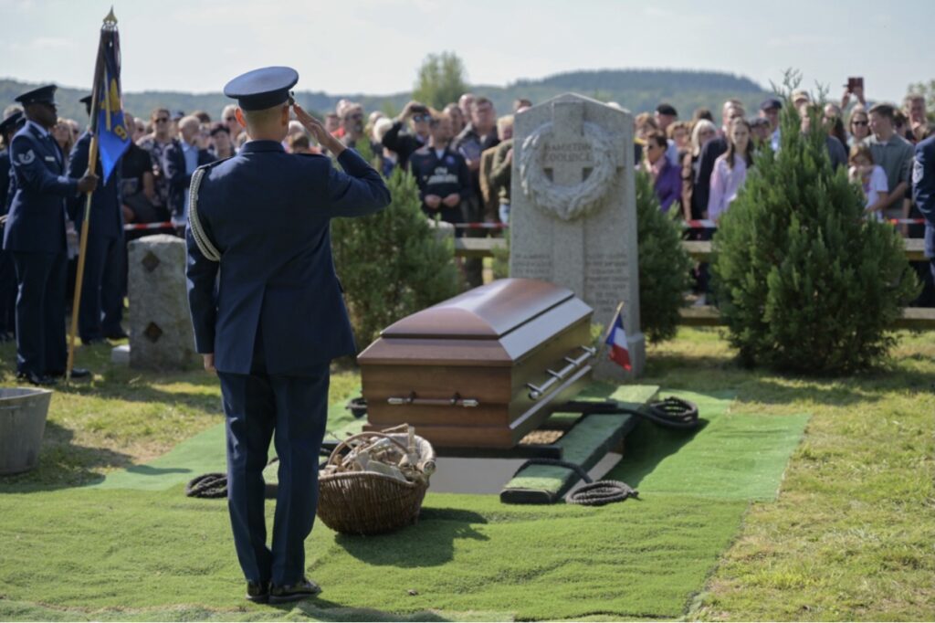 U.S. Air Force Colonel Jake Brittingham salutes during the reinterment of Captain Hamilton Coolidge.